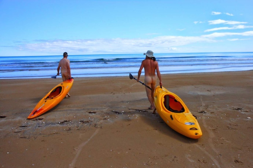 Nudists go for a paddle at Bakers Beach