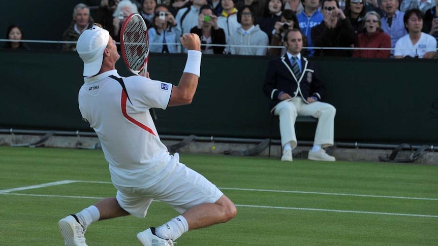 Australia's Lleyton Hewitt on his knees after beating Japan's Kei Nishikori at Wimbledon in 2011.
