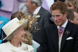 Queen Elizaberth II smiles as Prince Harry pulls a face