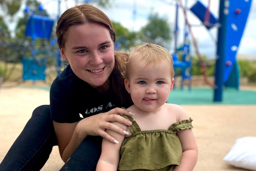 Amelia Finney and two-year-old Skyla Finney-Hampton in a playground.