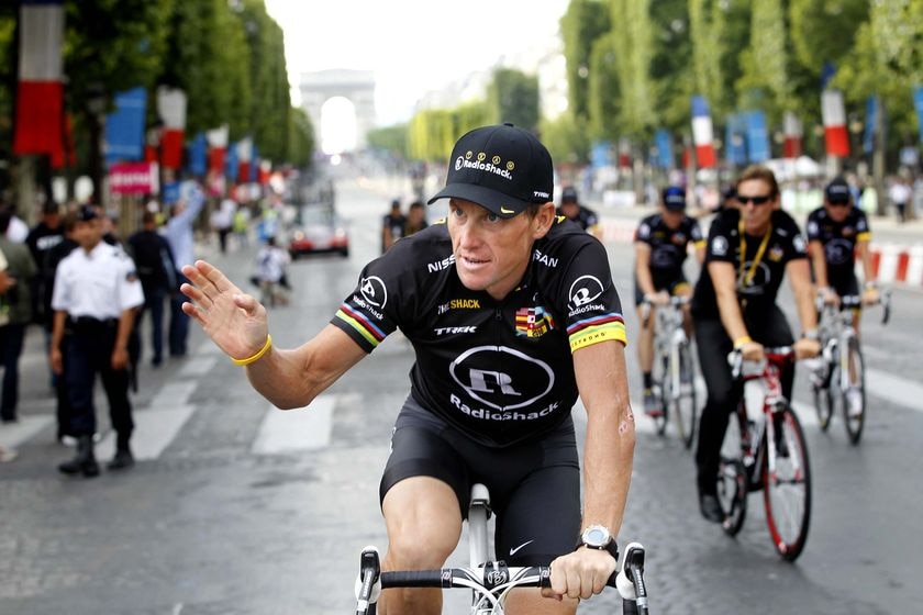 Lance Armstrong waves to the crowds in Paris.