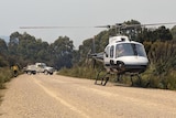 Helicopter sent to evacuate Tristan North and friends due to bushfire concerns.