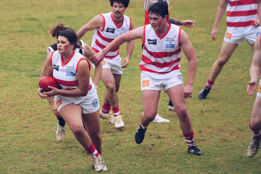 Media personalities, wearing AFL uniforms, play in the Reclink Community Cup