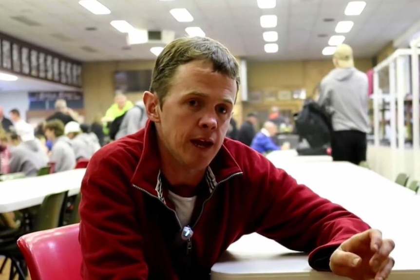 Jack Maher sits at a table in Wodonga Bulldogs clubrooms