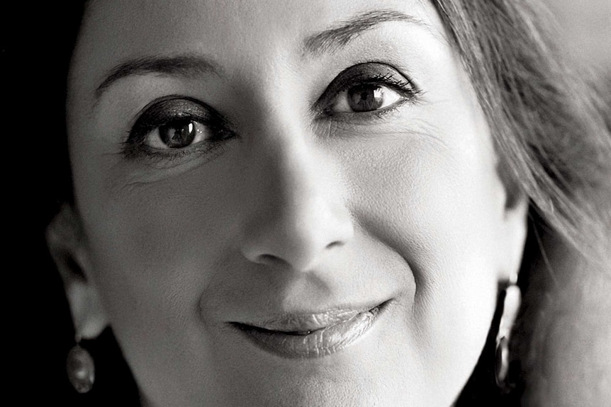 A black and white headshot of Daphne Caruana Galizia