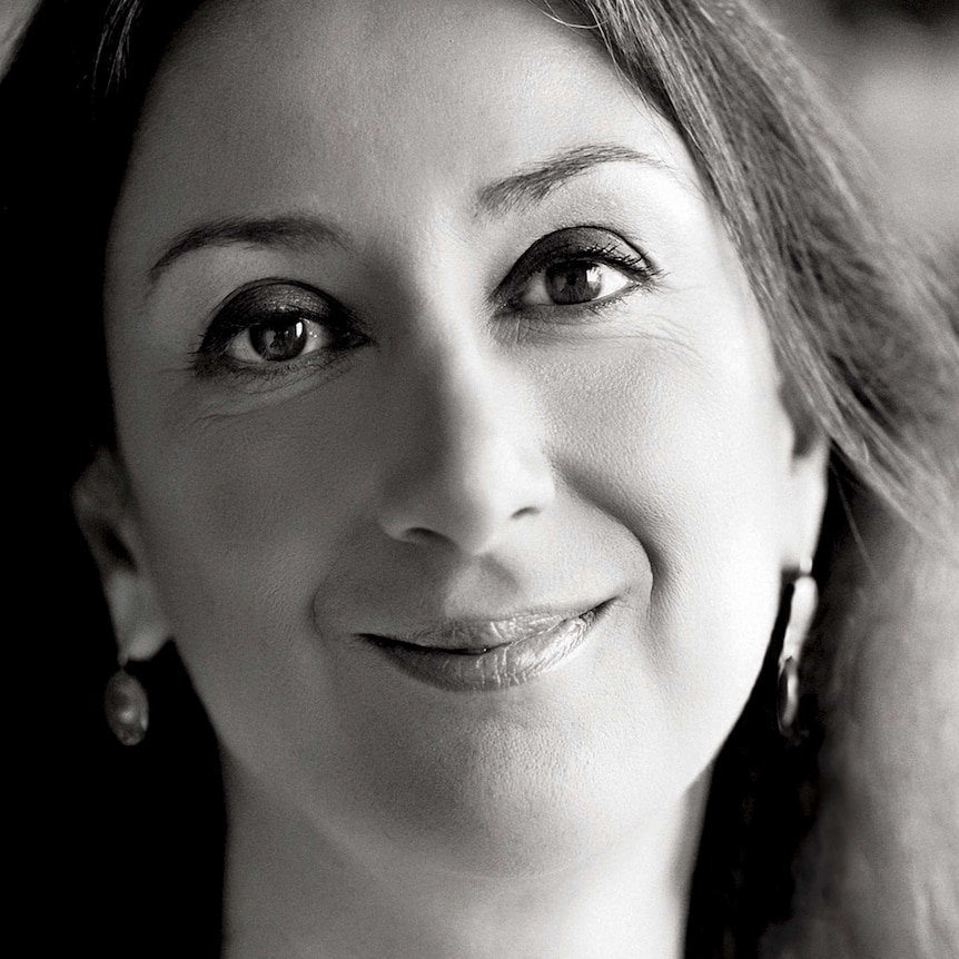 A black and white headshot of Daphne Caruana Galizia