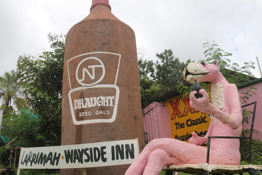 Statues of the pink panther and a beer bottle
