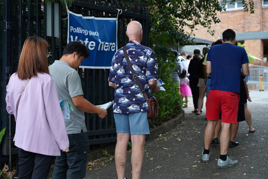 Voters queue at a polling booth