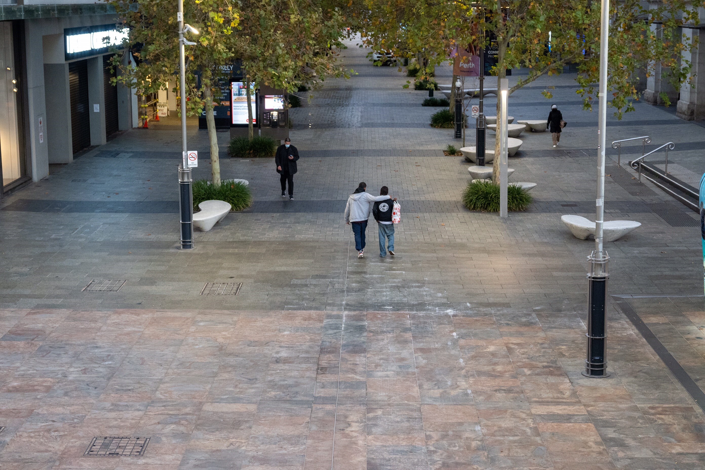 A quiet Murray Street mall in Perth viewed from above, with only a few people walking through it.