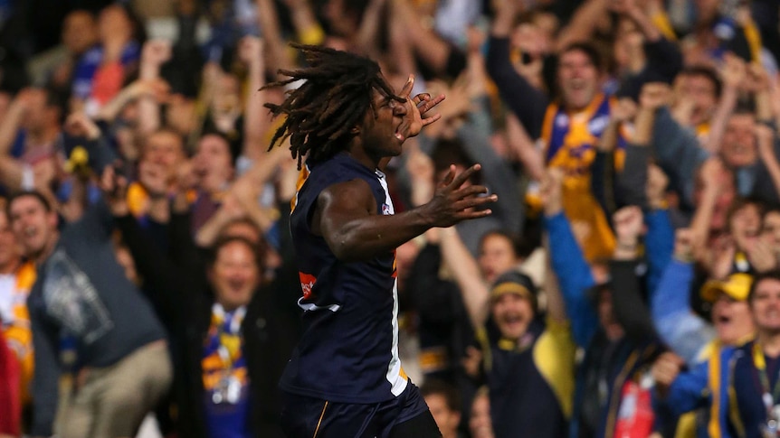 West Coast's Nic Naitanui celebrates kicking the winning goal against the Kangaroos.