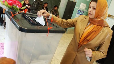 An Iraqi woman votes in 2005 parliamentary elections