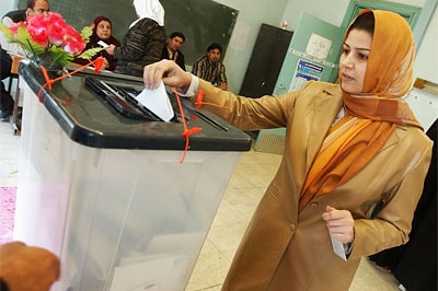 An Iraqi woman votes in 2005 parliamentary elections