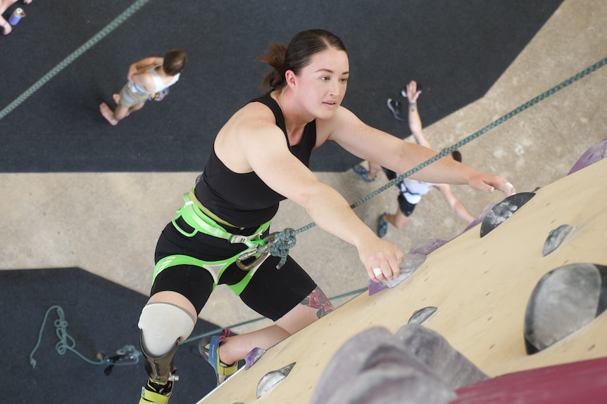 Australian paraclimber Sarah Larcombe climbs a wall at Urban Climb, Blackburn