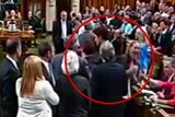 An MP reacts after PM makes physical contact