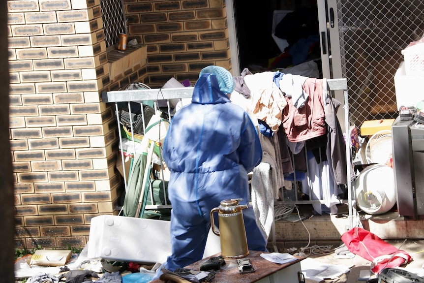 Forensic officer at the Kangaroo Point apartment which had been declared a crime scene.