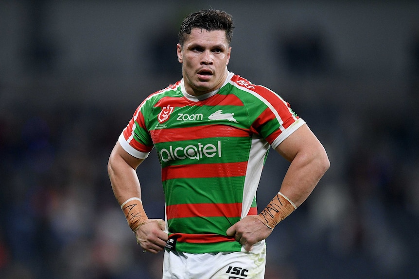 A South Sydney NRL player stands with his hands on his hips during the 2019 season.