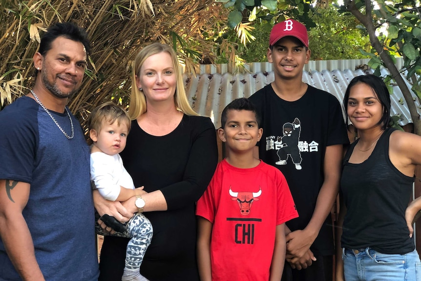 White-skinned Mala Fairborn with her husband and children, who all have dark skin.