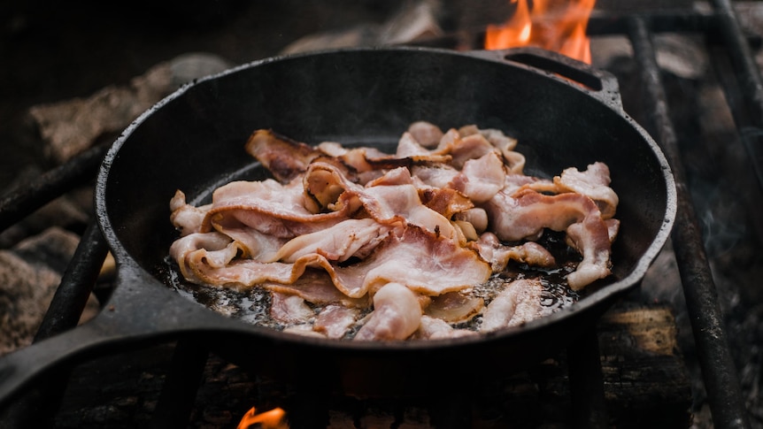 Bacon frying in a pan