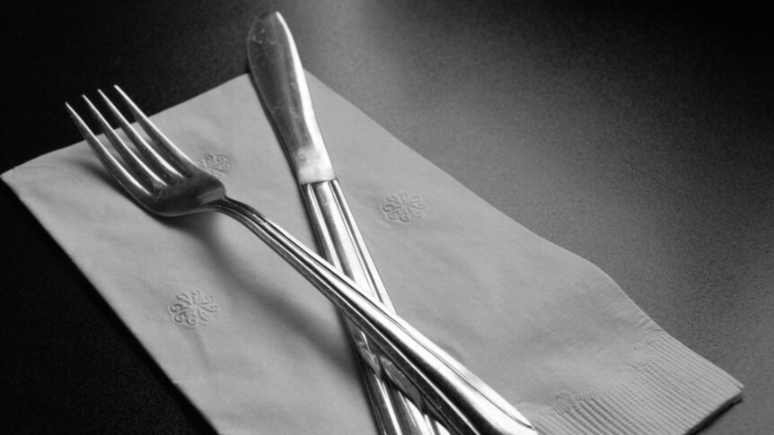 Knife and fork with napkin