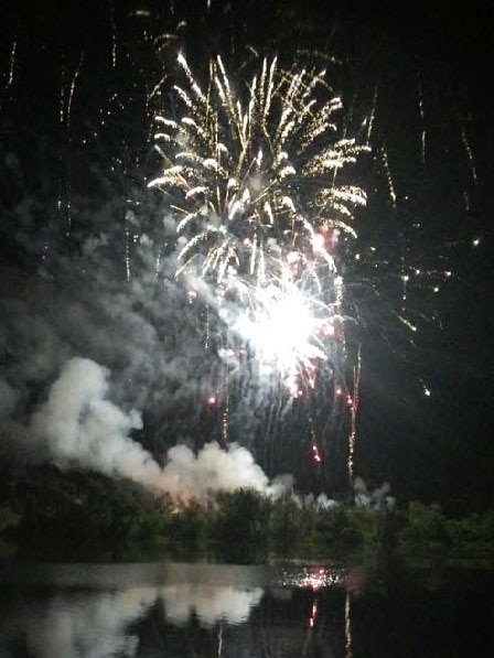 Fireworks reflect in the Murray