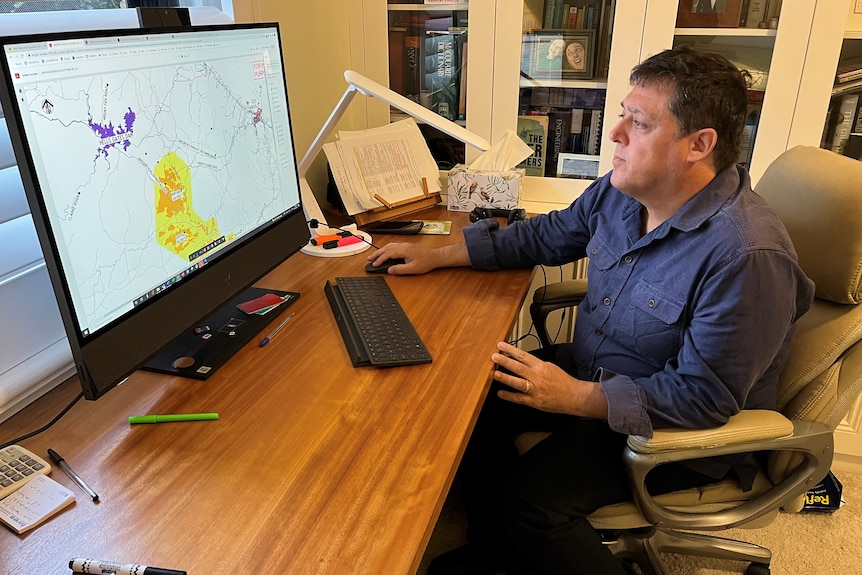 a man sitting at a computer.