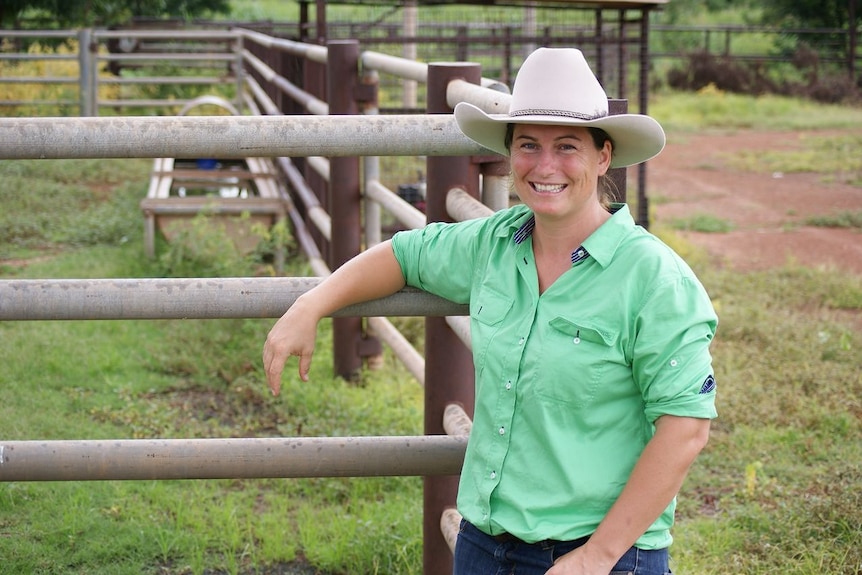 Catherine Marriott leans on a fence