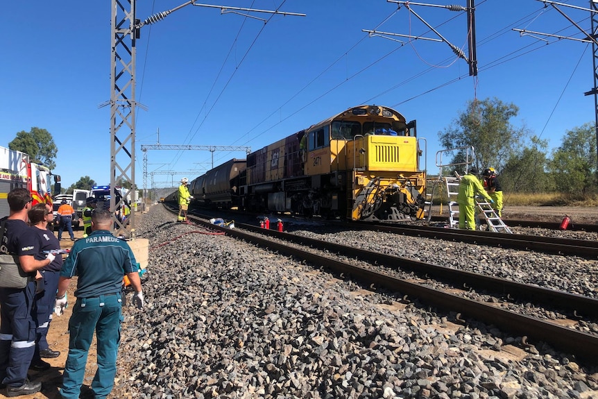Emergency services staff and coal train involved in a collision with another locomotive near Westwood, west of Rockhampton. 