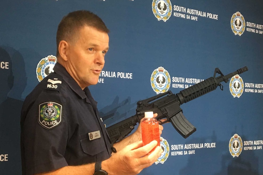 A police officer holding a gun