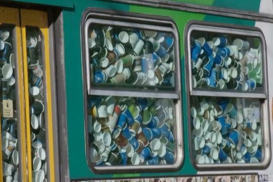 Thousands of takeaway coffee cups packed into a Melbourne tram