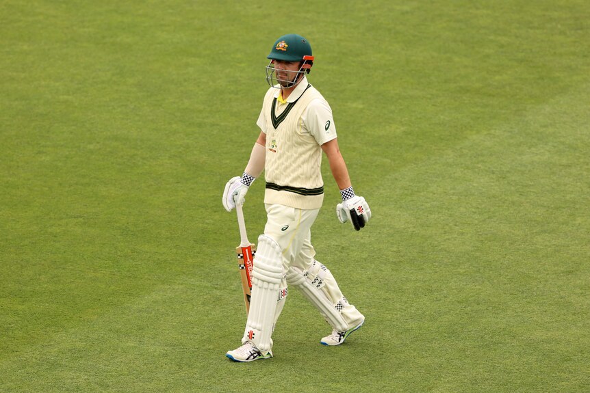 Australia batter Travis Head walks off after being dismissed in the Ashes Test in Hobart.