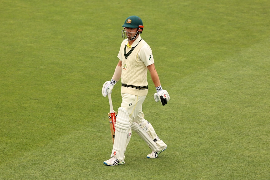 Australia batter Travis Head walks off after being dismissed in the Ashes Test in Hobart.