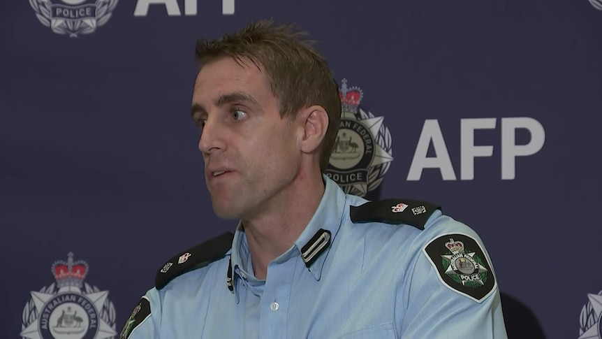 A police officer speaks during a media conference.