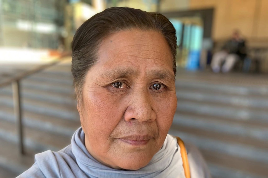 Aunty Misi Sulesa stands outside Ipswich court.