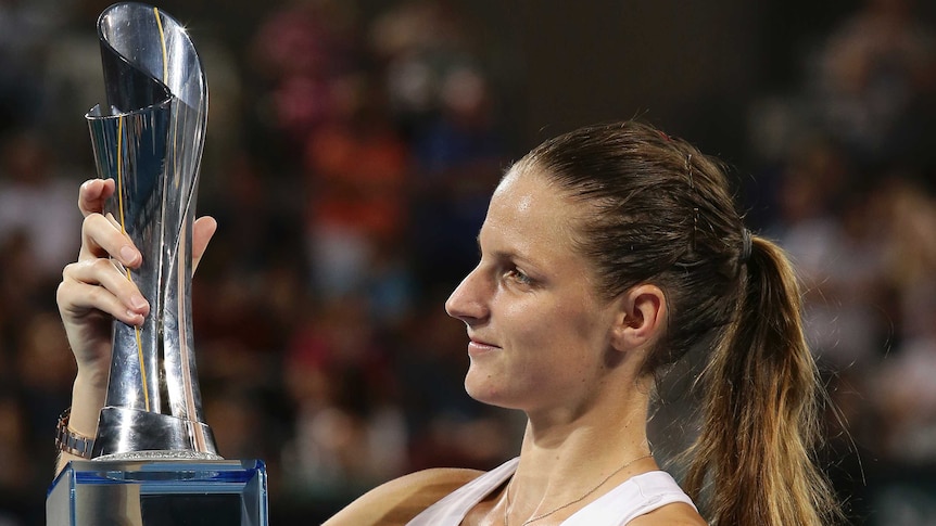 Czech Karolina Pliskova poses with the trophy after winning the Brisbane International final.