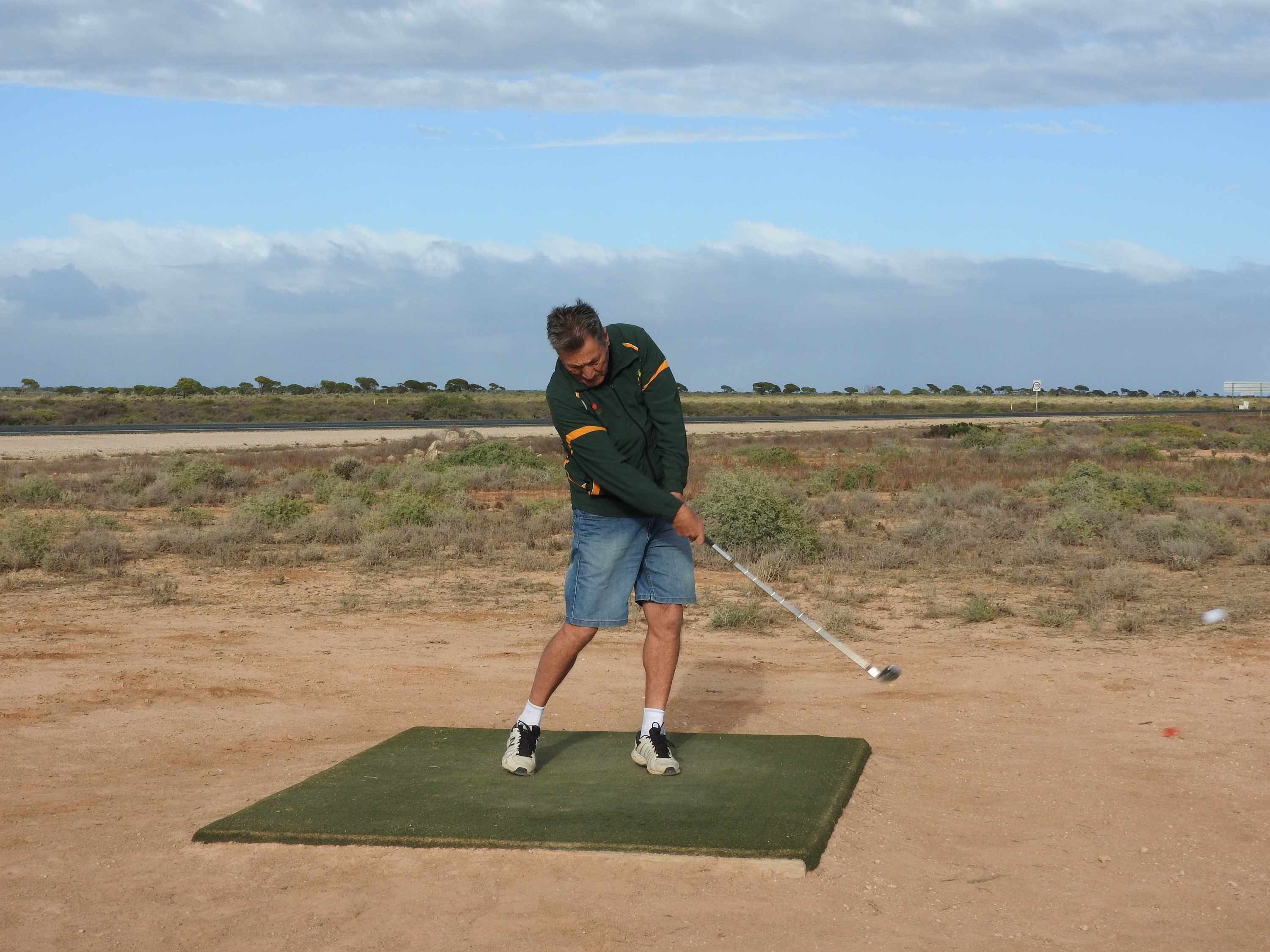 Male golfer teeing off on Nullarbor Links golf course