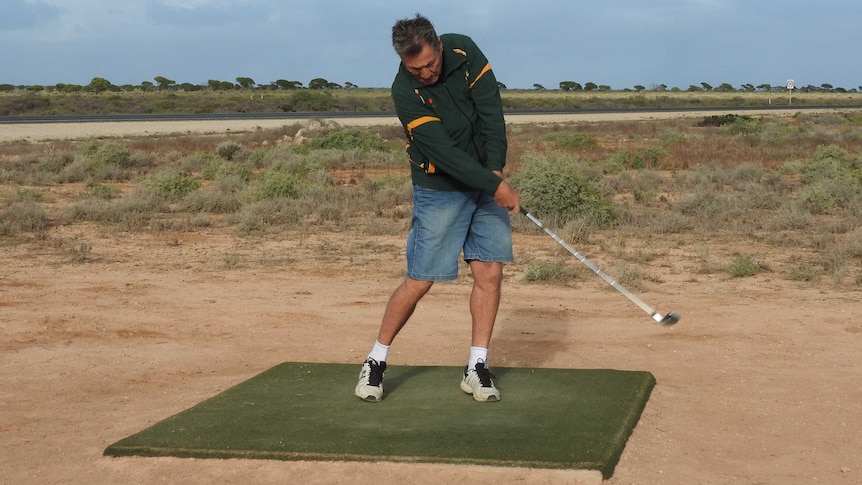 Male golfer teeing off on Nullarbor Links golf course