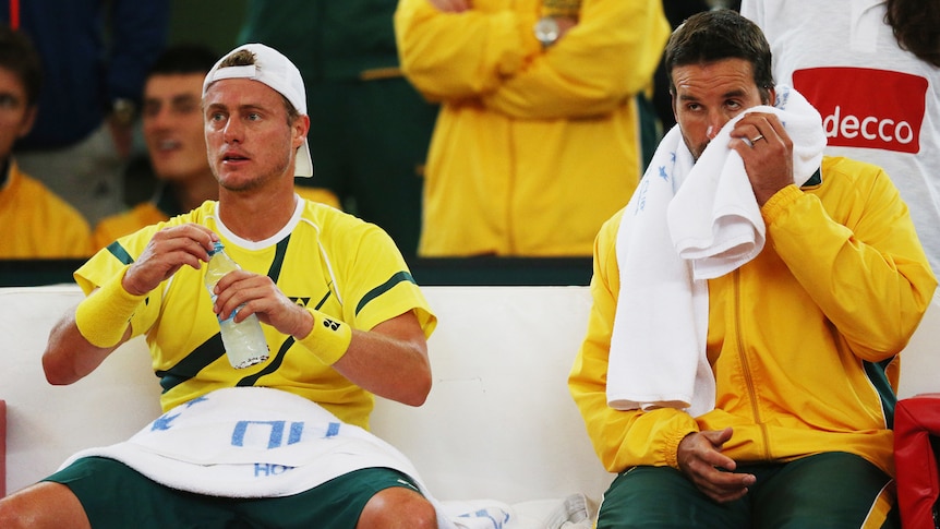 Australia's Lleyton Hewitt (L) and Pat Rafter during Hewitt's loss to Germany's Florian Mayer