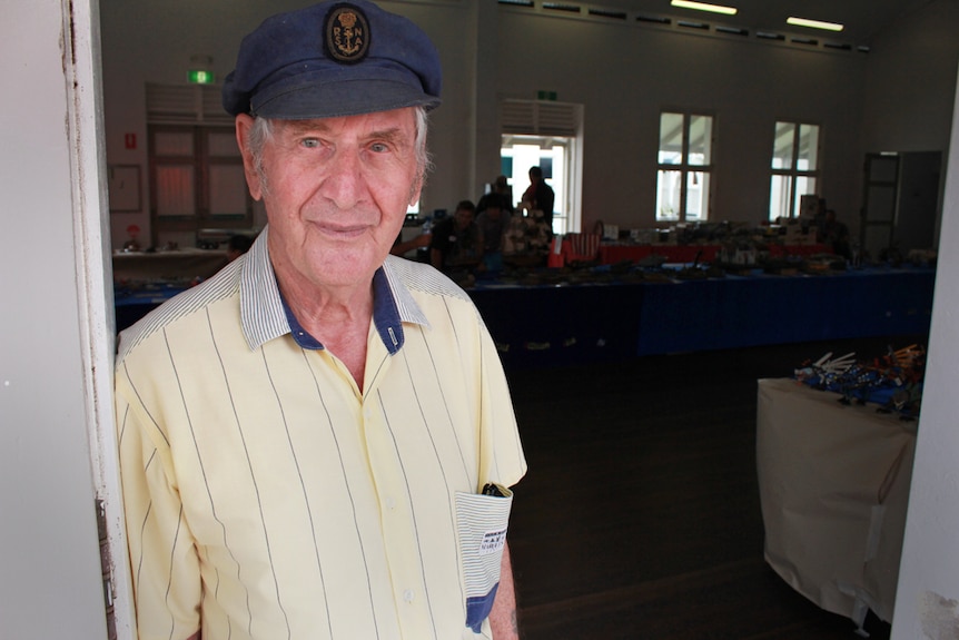 Close up shot of elderly man with a sailing hat