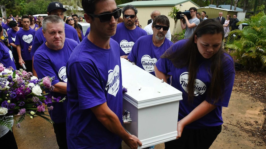 Pallbearers, including Rick Thorburn, carry the coffin of Tiahleigh Palmer