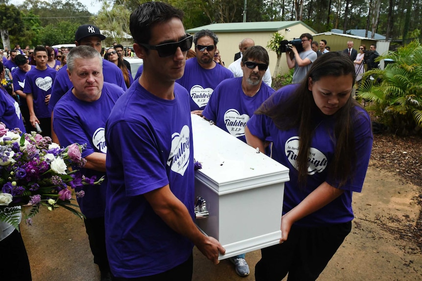 Pallbearers, including Rick Thorburn, carry the coffin of Tiahleigh Palmer