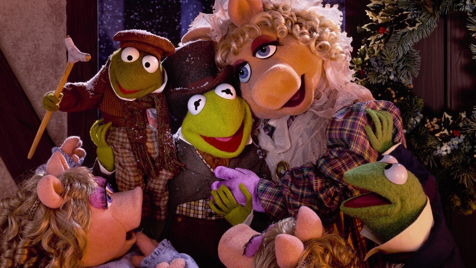 “Muppet characters in Victorian costumes celebrating together in a festive holiday setting.”