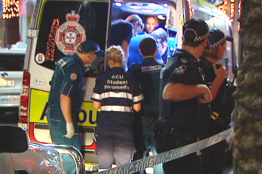 Queensland Ambulance staff on the scene of a one-punch attack on the Gold Coast.
