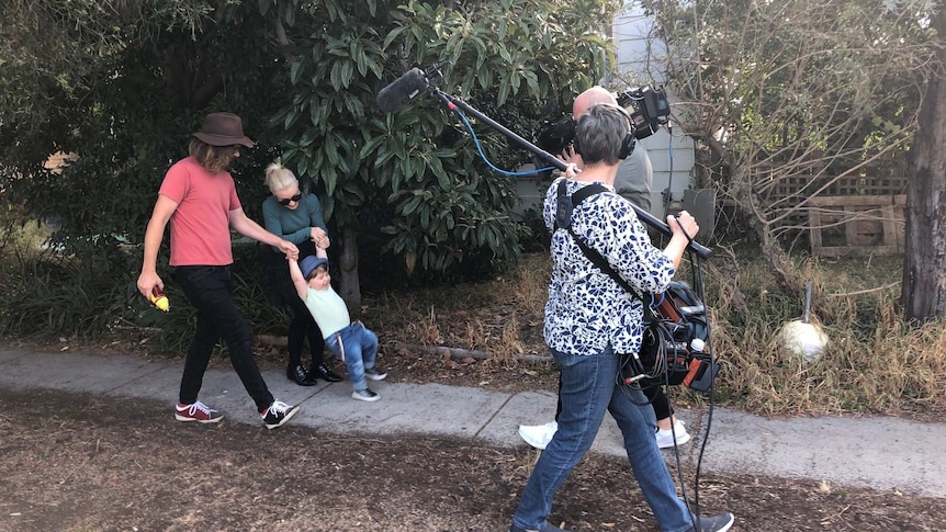 Kate Miller-Heidke with her family being filmed