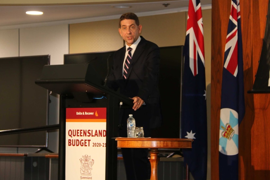 Cameron Dick speaking on stage at a lectern