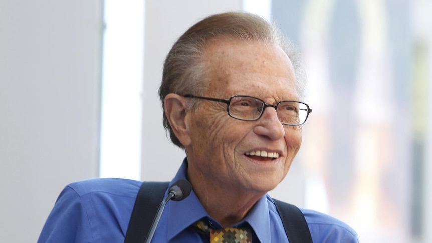 Larry King smiling