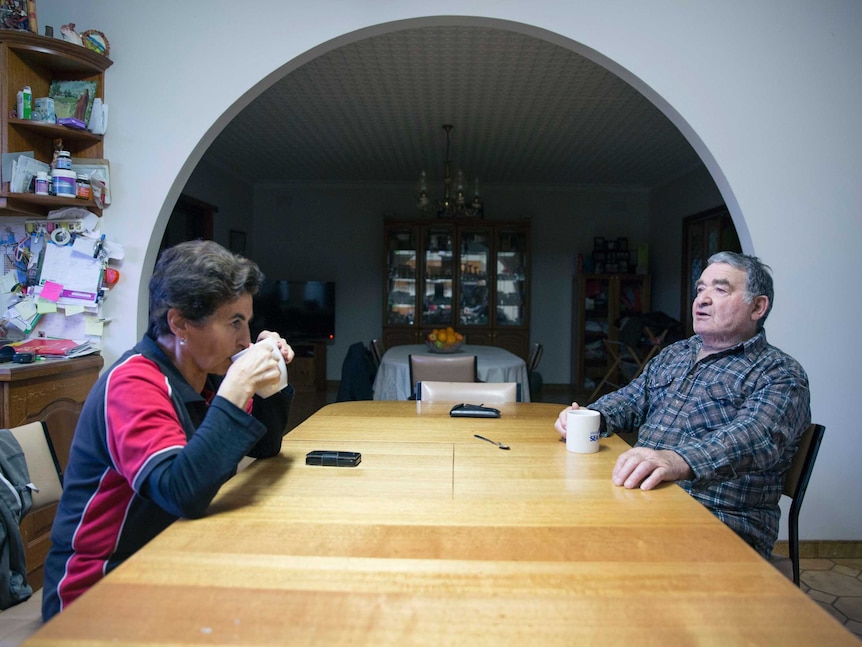 Rita and Tony Faranda have coffee at the kitchen table