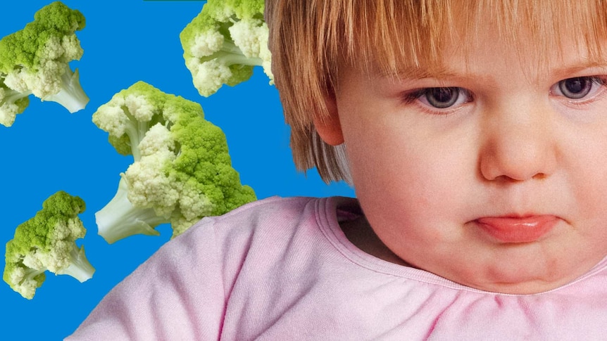 A stylised photo of a grumpy looking child with broccoli in the background to depict picky eaters.