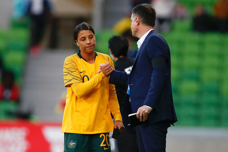 Matildas captain Sam Kerr shakes hands with coach Ante Milicic.