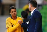 Matildas captain Sam Kerr shakes hands with coach Ante Milicic.