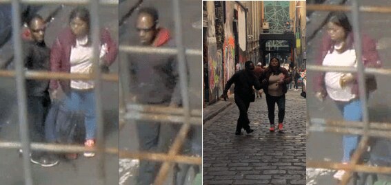 A man and woman pictured from security cameras walking along Hosier Lane.
